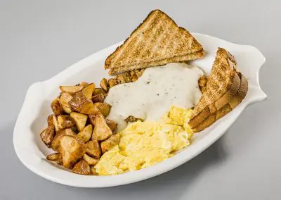 Nutcracker Restaurant - Chicken Fried Steak Breakfast with fresh breakfast potatoes, scrambled eggs, and toast