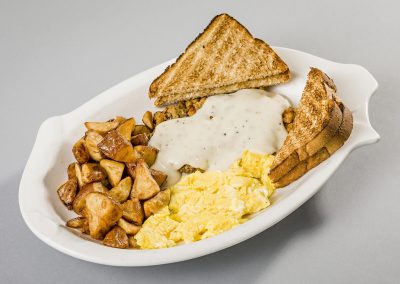Nutcracker Restaurant - Chicken Fried Steak Breakfast with fresh breakfast potatoes, scrambled eggs, and toast