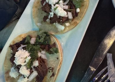Fronteras Restaurant - Barbacoa Tacos with soft corn shells, also onion, shaved queso fresco, and cilantro
