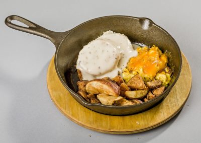 The Nutcracker Restaurant - Breakfast Skillet with eggs & cheese, homemade potato wedges, plus biscuit with gravy